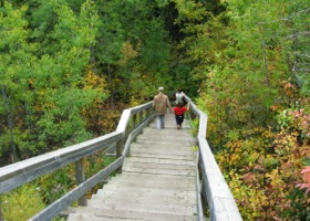 two people on river valley path